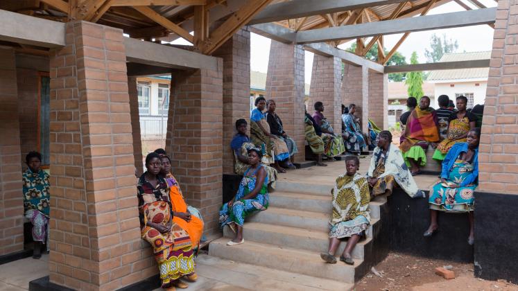 Photo of Maternity Waiting Village, Photo by Iwan Baan, mothers socializing in the outdoor hallways