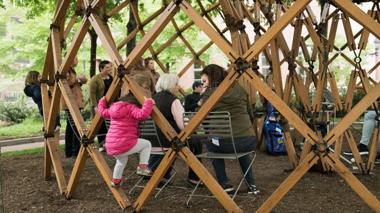 Photo of Design Biennial Boston, Child playing on the pavilion during spring concert