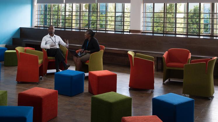 Photo of Young African Leaders Initiative, Two people chatting in open layout seating