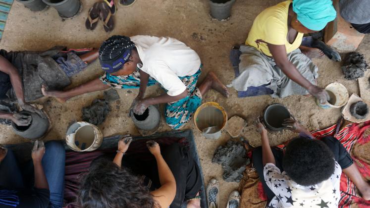 Photo: ADC fellows practicing traditional pottery techniques at Urukundu Village