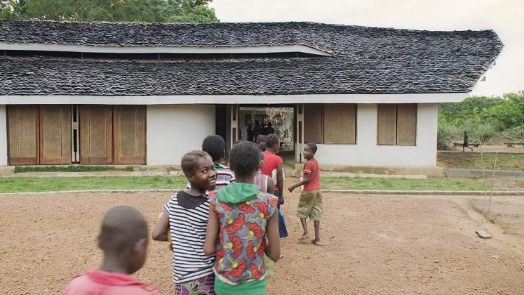 Photo of Ilima Primary School, View of hte school children lining up to go into the school from the Courtyard
